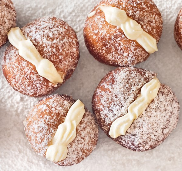 Round doughnuts with vanilla custard cream