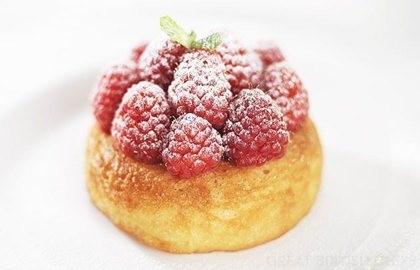Rum baba with raspberries