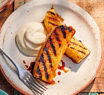 Rum-glazed grilled pineapple with lime crème fraîche