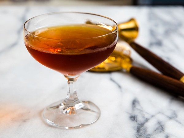 Rum, Scotch, and Cynar cocktail (100-year-old cigar)