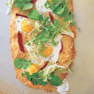Rustic flatbread with egg, arugula, and pecorino