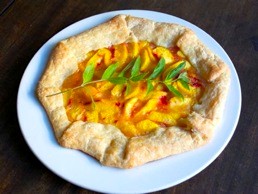 Rustic peach and cornmeal tart with lemon verbena cream