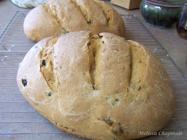 Rustic peasant loaf with black olives and sun-dried tomatoes