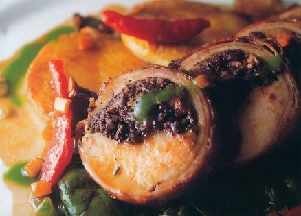 Saddle of rabbit with black pudding, roast vegetable and wild mushroom juice
