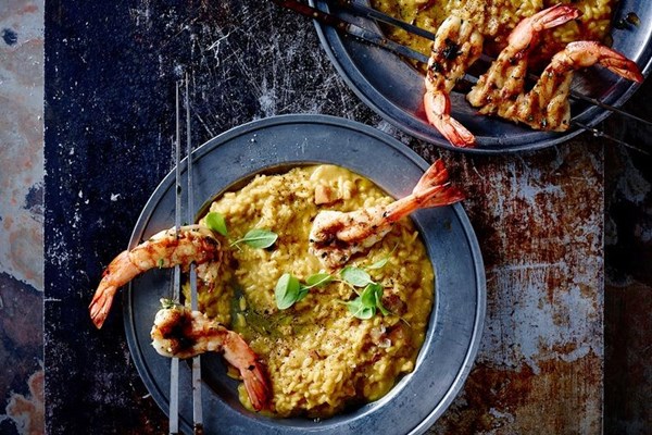 Saffron & pancetta risotto with herb butter king prawns