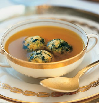 Saffron chicken broth with spinach matzo balls