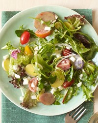 Saffron fingerling potato salad with mixed greens and tomatoes