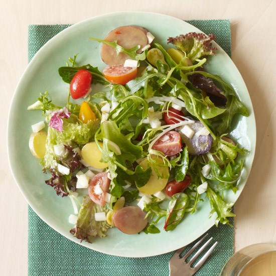 Saffron fingerling potato salad with mixed greens and tomatoes