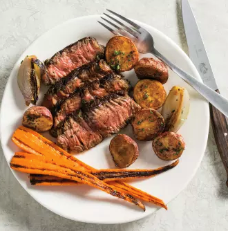Sage-crusted rib-eye steaks with roasted vegetables