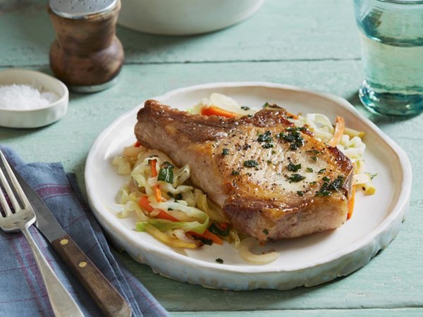 Sage-rubbed pork chops with warm apple slaw