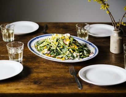 Salad of asparagus, arugula, egg, and radish with mustard vinaigrette