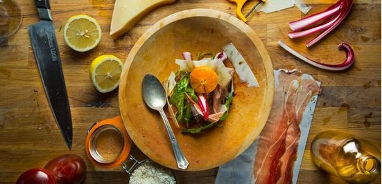 Salad of bitter greens with speck and clementine