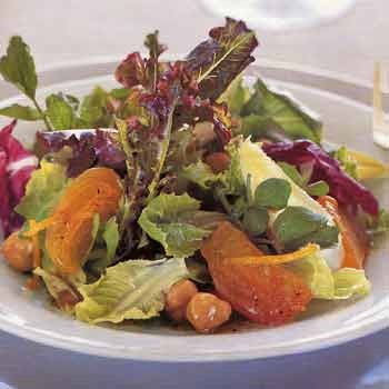 Salad of fall greens with persimmons and hazelnuts