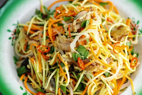 Salad of stir-fried prawns, pork and squid with glass noodles, chilli and mint