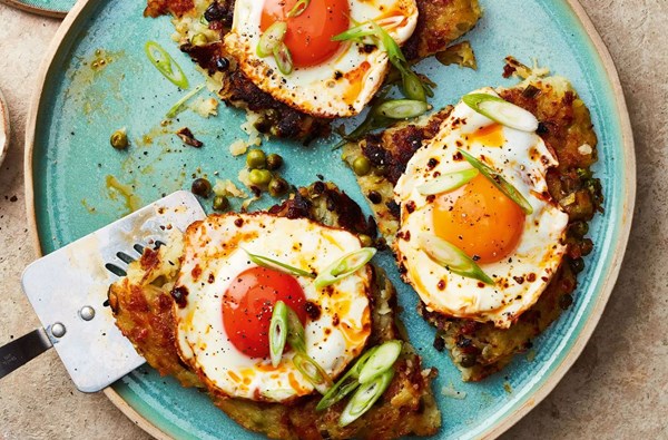 Salad onion, pea & halloumi röstis with harissa fried eggs