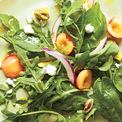 Salad with cherries, goat cheese, and pistachios