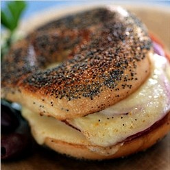 Salami and horseradish cheddar bagel sandwich