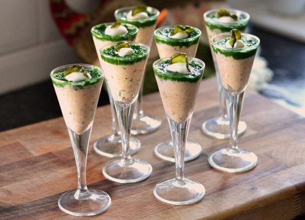Salmon and crème fraîche shots topped with watercress purée and pickled cucumber