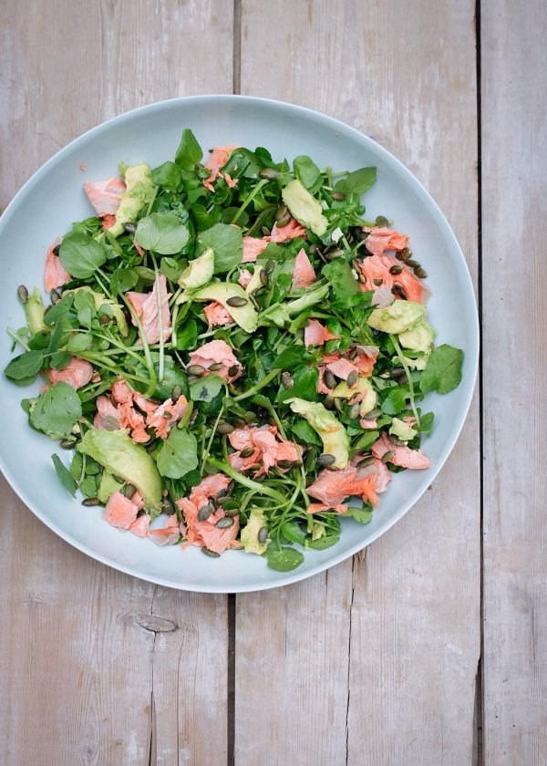 Salmon, avocado, watercress and pumpkin seed salad