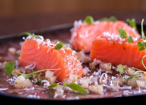 Salmon cooked in lime oil with sweet and sour celeriac and a citrus gel
