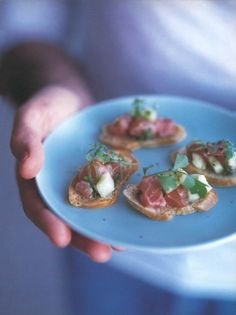 Salmon, mint and cucumber salad on crostini