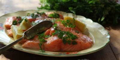 Salmon poached in olive oil with tomato and avocado salsa