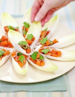 Salmon poke in endive leaves