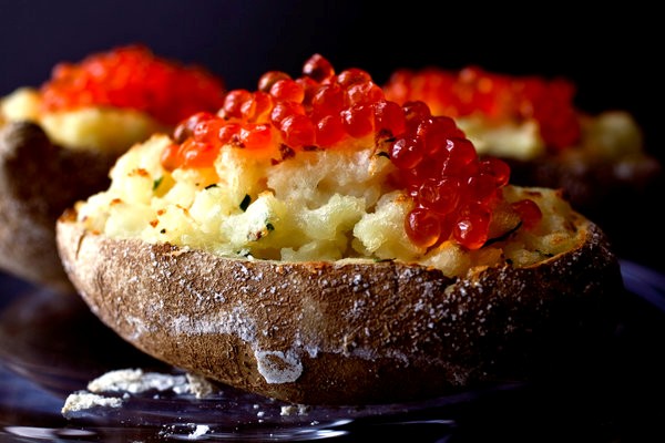 Salmon-roe-topped baked potatoes with crème fraîche