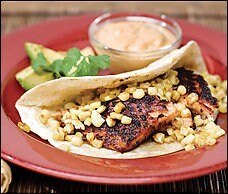 Salmon tacos with roasted corn and chili adobo cream