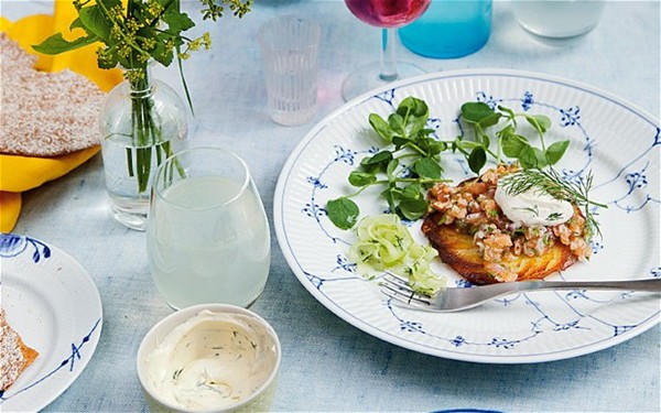 Salmon tartare on crisp potato cakes with pickled cucumber