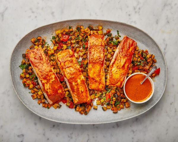 Salmon traybake with harissa-roasted pepper sauce