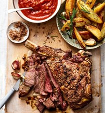 Salt and pepper rib of beef with Bloody Mary sauce and roast potato wedges