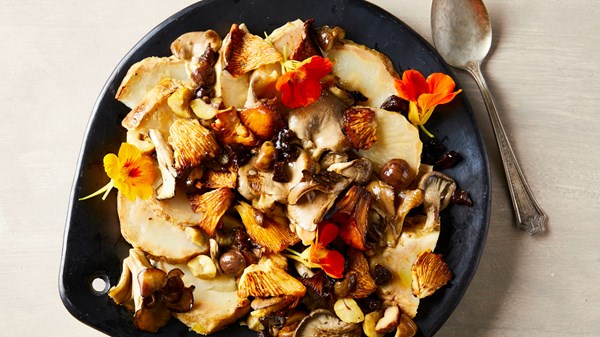 Salt-baked celeriac with mushrooms, chestnuts, and prunes