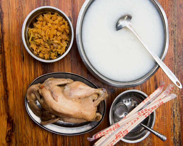 Salt-baked chicken with congee and pickled mustard greens