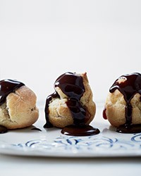 Salted-caramel cream puffs with warm chocolate sauce