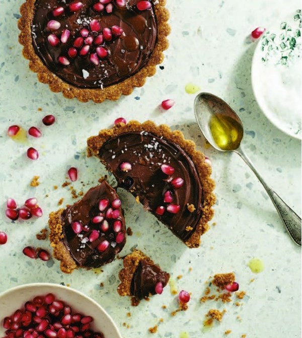 Salted chocolate pie with walnut crust and pomegranates
