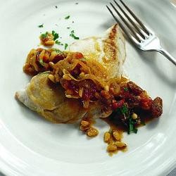 Salted fish with raisins and pine nuts