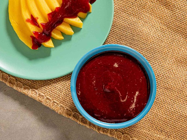 Salty and spicy Mexican pickled fruit sauce (Chamoy)