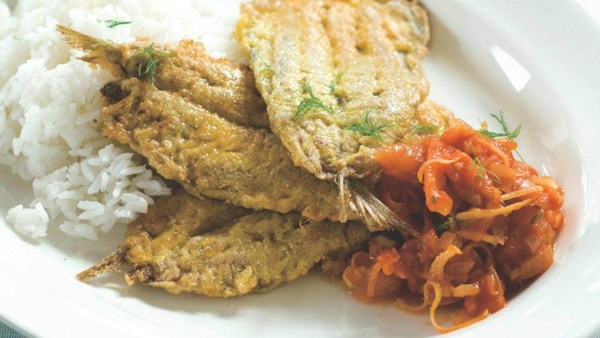 Sardines with fennel and tomato sauce on rice