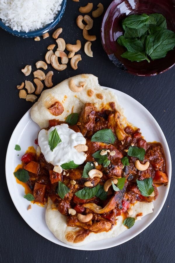 Saucy Indian spiced chicken with naan
