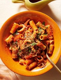 Saucy paccheri with calamari, sausage, and breadcrumbs