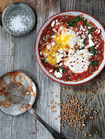 Saucy tomato poached eggs with kale and wheat berries