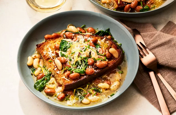 Saucy white beans and greens on toast