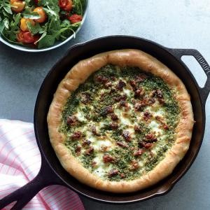Sausage and kale pesto pizza with blistered tomato-arugula salad