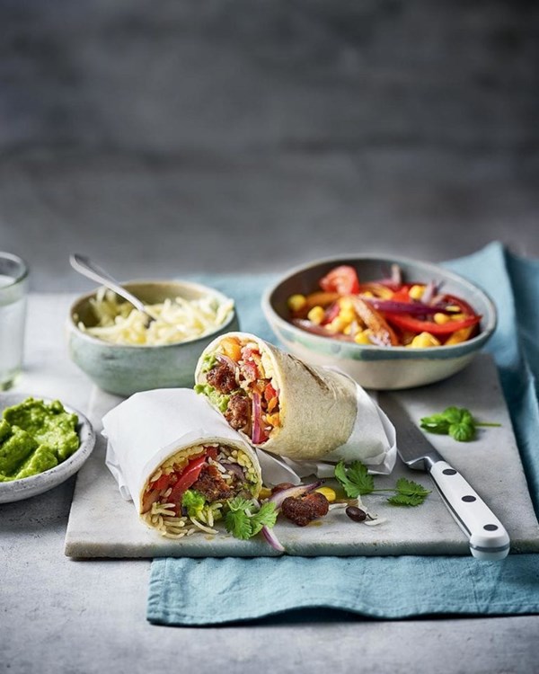 Sausage burritos with pea and avocado guacamole 