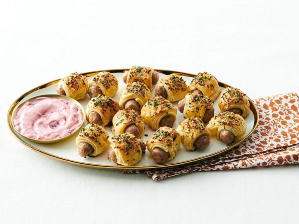 Sausage pigs in a blanket with cranberry dip