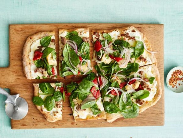 Sausage pizza with spinach salad
