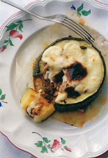 Sausage-stuffed marrow with white sauce