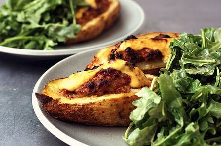 Sausage-stuffed potatoes and a green salad
