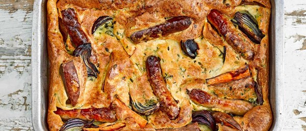 Sausage, sweet potato, and red onion toad-in-the-hole with mustard gravy